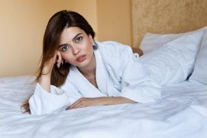 girl sleeping away from pillow