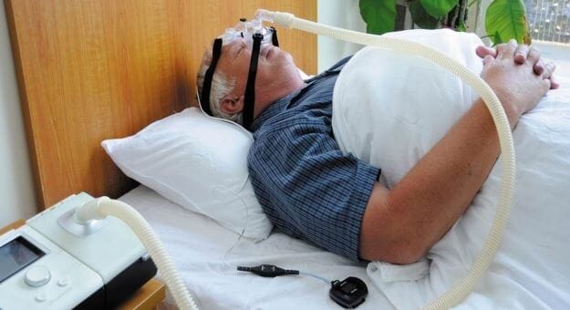 man wears cpap device